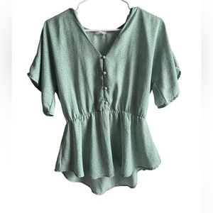 Light green shirt with small white polka dots. Size XS